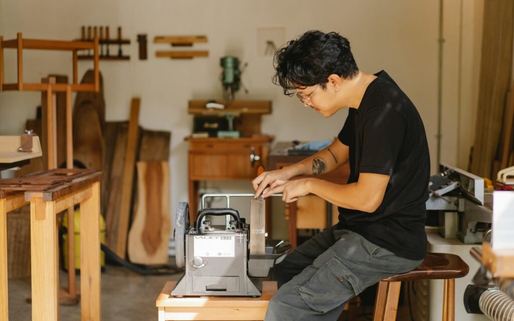 craftsman repairing wooden furniture in a workshop