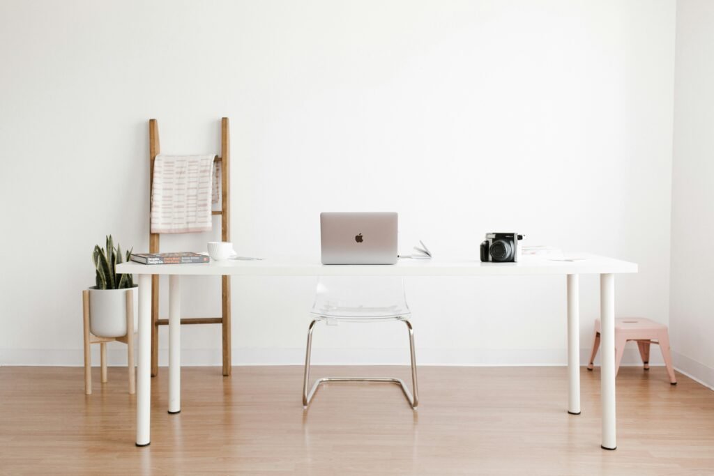 minimalist home office with white desk and chair