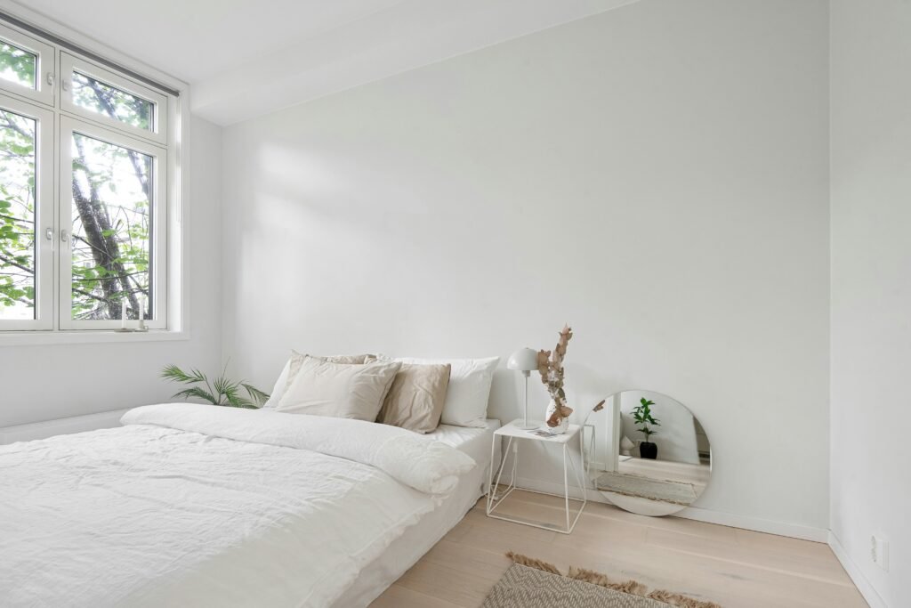 minimalist bedroom with natural light and calm atmosphere