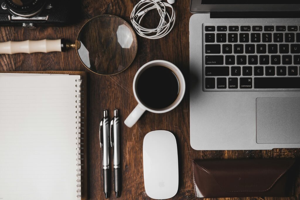 organized workspace with coffee and laptop for batching work