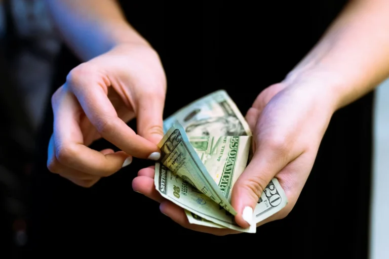 side hustles that pay cash — hands counting dollar bills to make money today