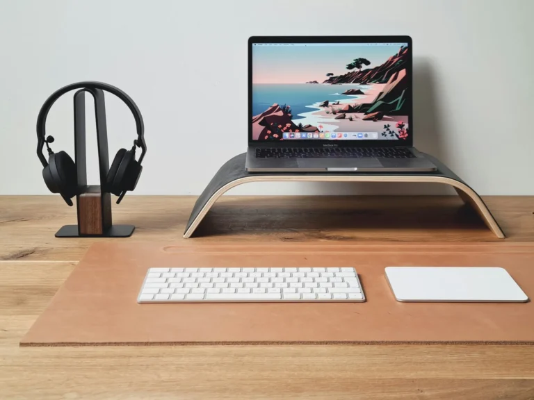 Minimalist desk setup with laptop and headphones representing micro side hustles under an hour