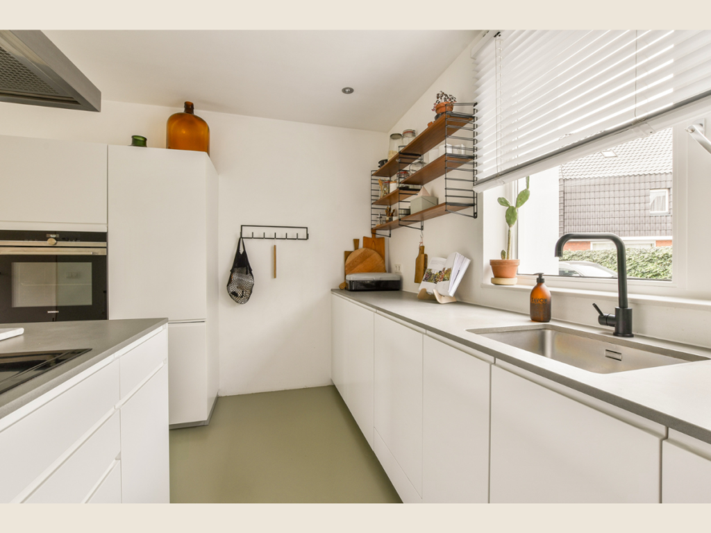 Minimalist organized kitchen space with clean counters and labeled freezer containers after a productive meal prep day.