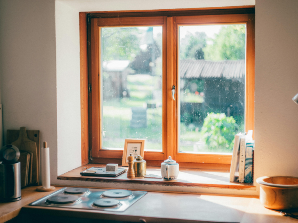 Minimalist kitchen with warm sunset light after a full day of freezer meal prep, reflecting calm and simple living.