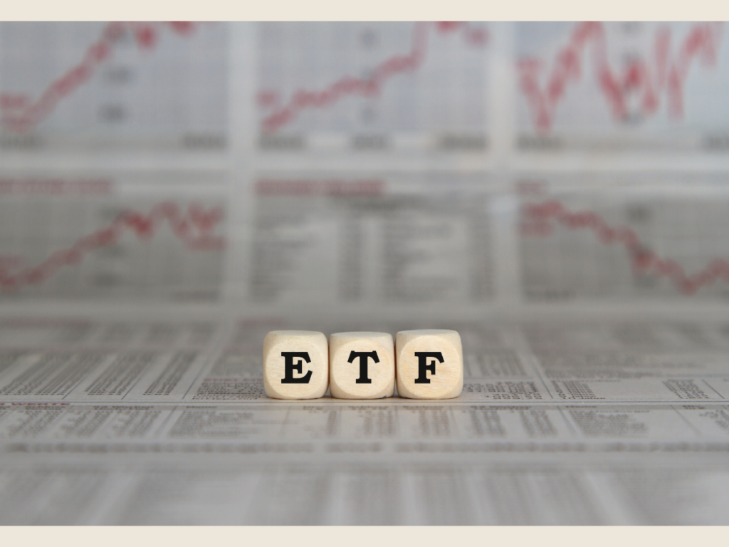 Portfolio minimalism with ETF letters on newspaper, representing simple investing and steady wealth growth.