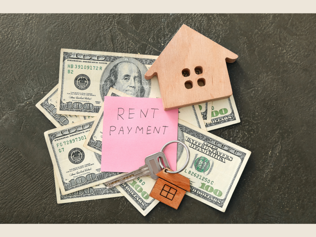 True cost of ownership visual with rent payment note and small house model, showing how financial minimalism reduces hidden costs.