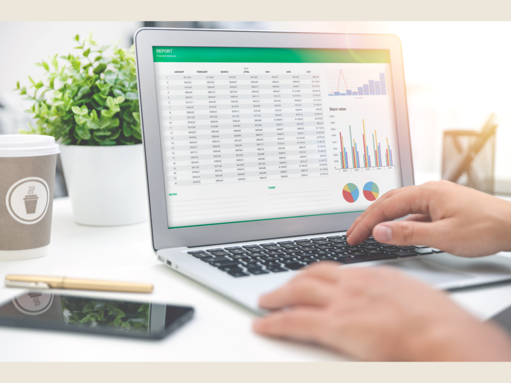 Hands typing on laptop with financial spreadsheet showing passive income analysis