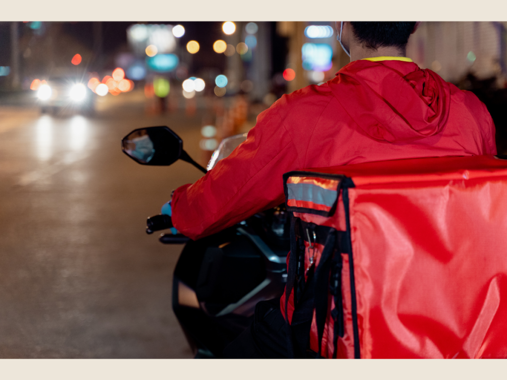 delivery driver night city lights doing side hustles after work for extra income