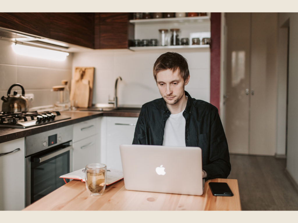 freelancer working at night laptop home office doing side hustles after work projects