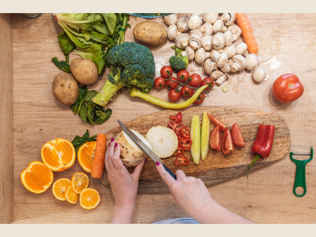 fresh vegetables being chopped on wooden board meal prep example of frugal living swaps and budget lifestyle tips